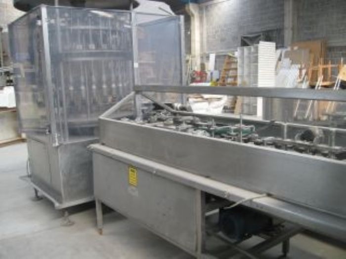 Llenadora rotativa de Liquidos y aproximadora de Botellas