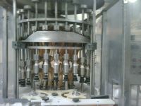 Llenadora rotativa de Liquidos y aproximadora de Botellas